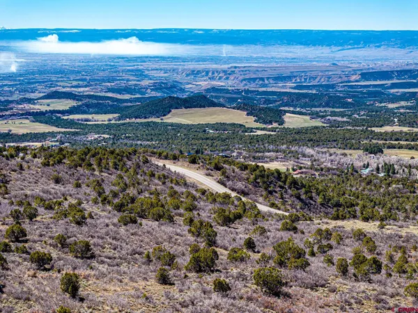 a view of a large building with an ocean