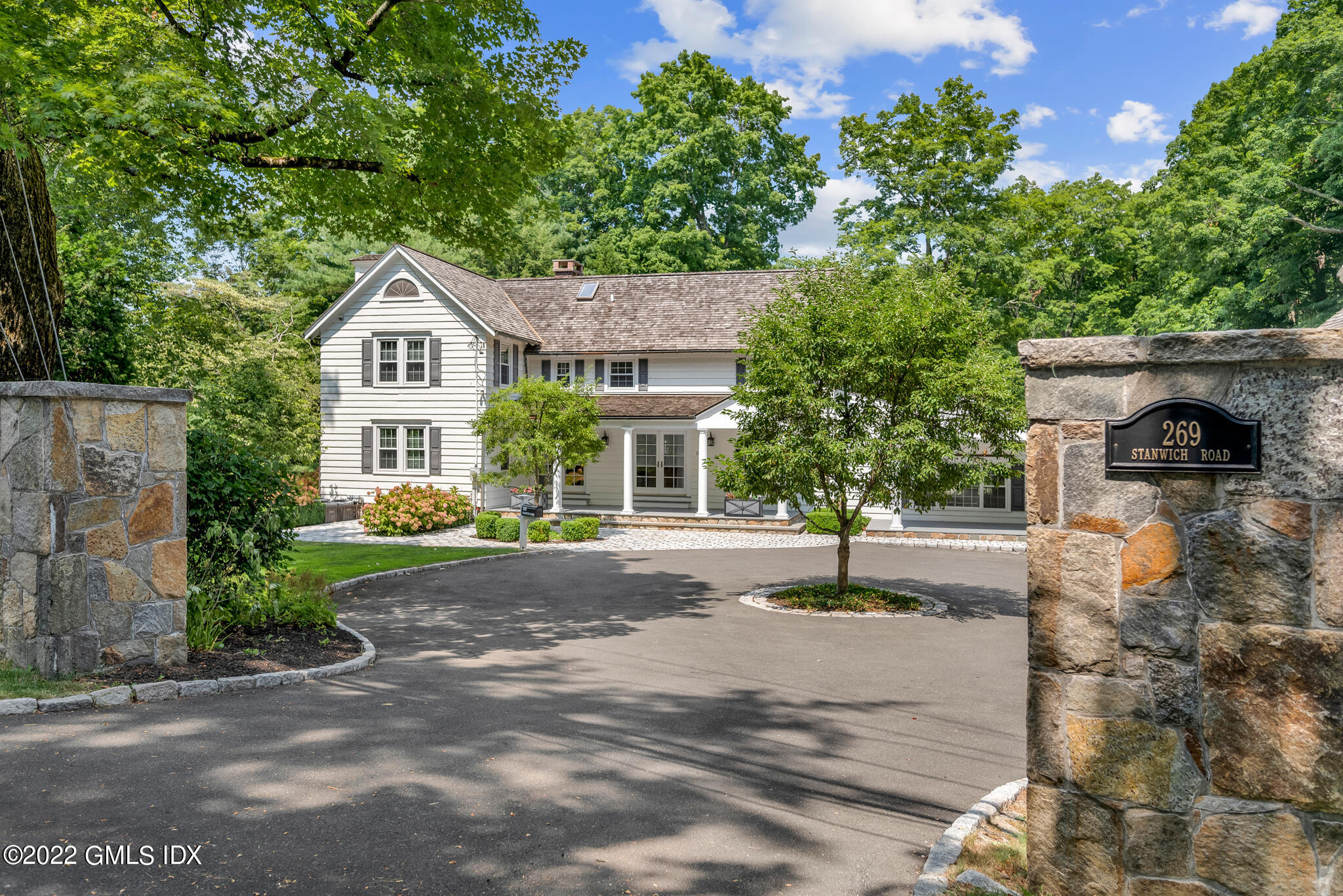269 Stanwich Road Greenwich, CT 06830 - Photo 1 of 19 a view of a house with a street