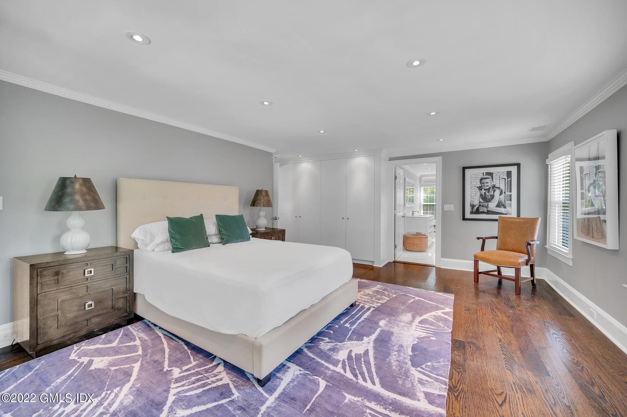 269 Stanwich Road Greenwich, CT 06830 - Photo 11 of 19 a spacious bedroom with a bed and chair