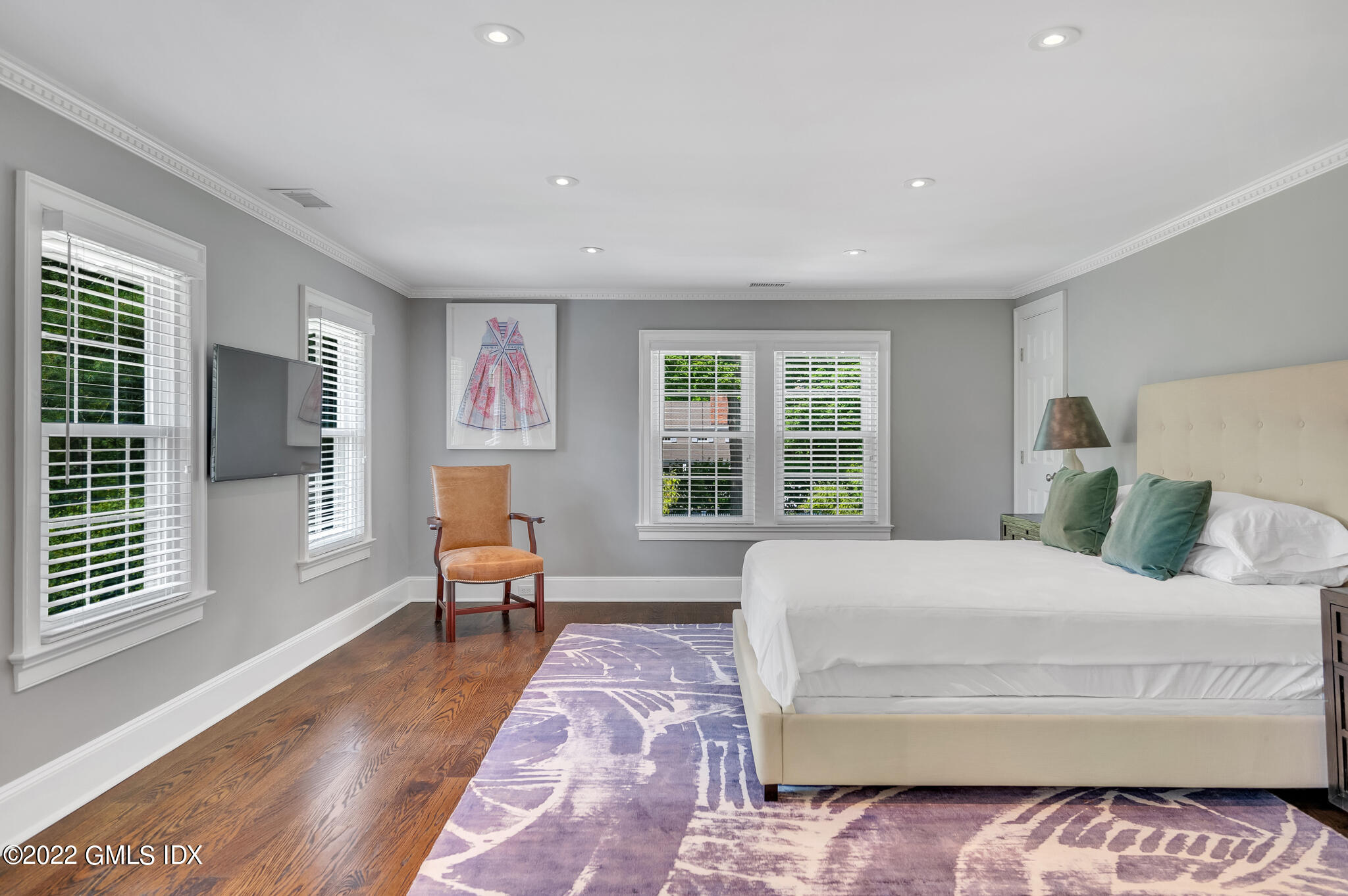 269 Stanwich Road Greenwich, CT 06830 - Photo 12 of 19 a bedroom with a large bed and a window