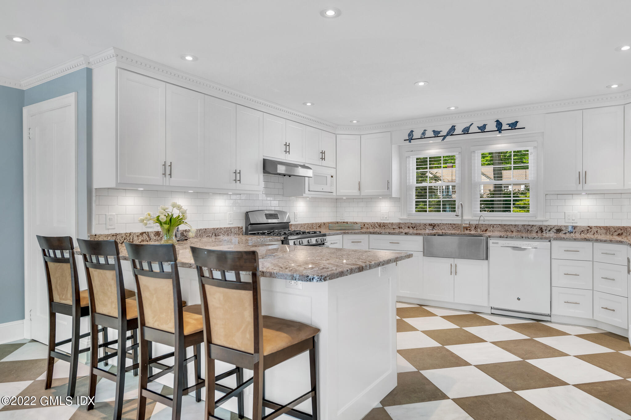 269 Stanwich Road Greenwich, CT 06830 - Photo 7 of 19 a kitchen with stainless steel appliances granite countertop a stove a sink and a refrigerator