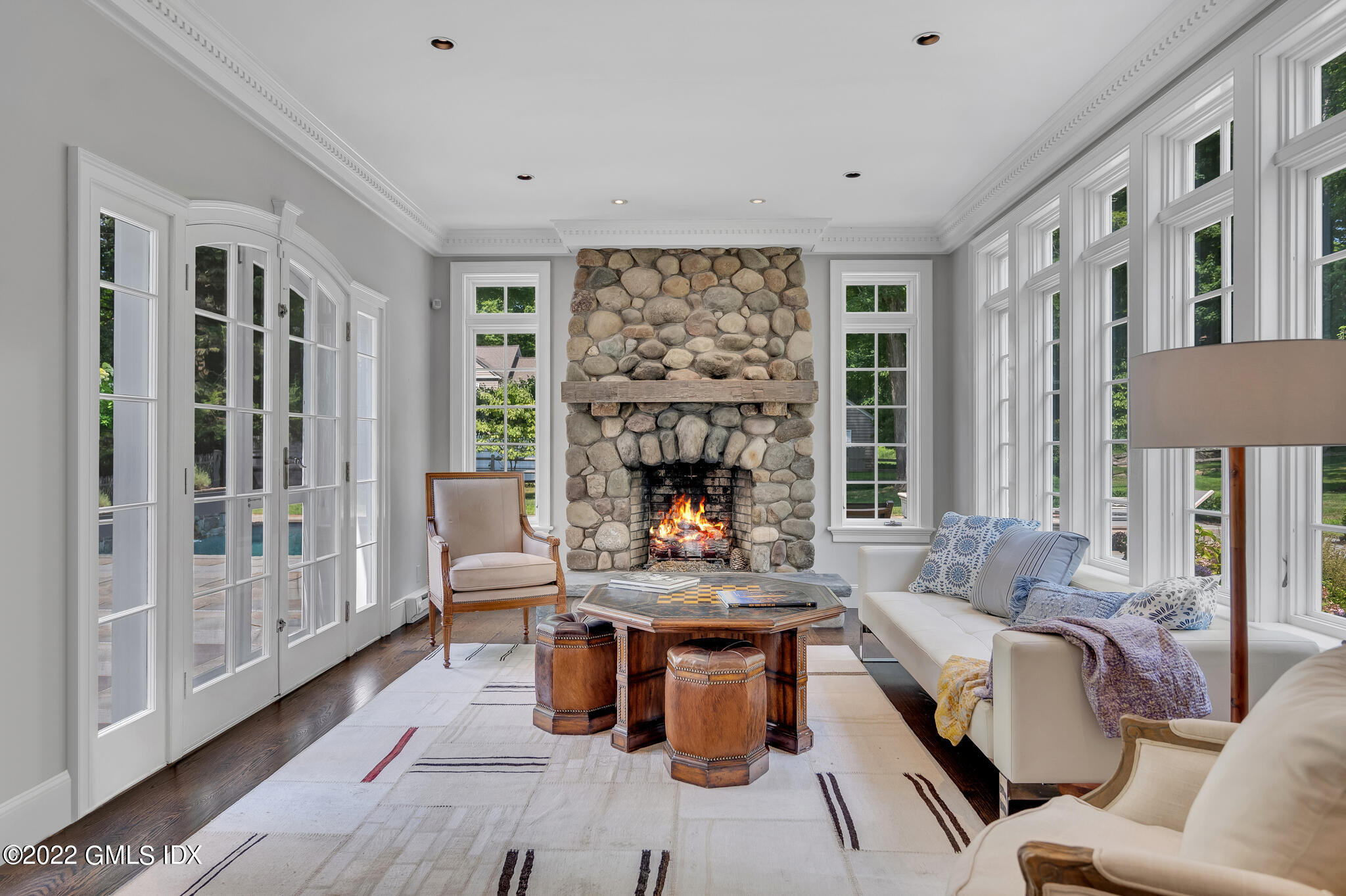 269 Stanwich Road Greenwich, CT 06830 - Photo 8 of 19 a living room with furniture and a fireplace