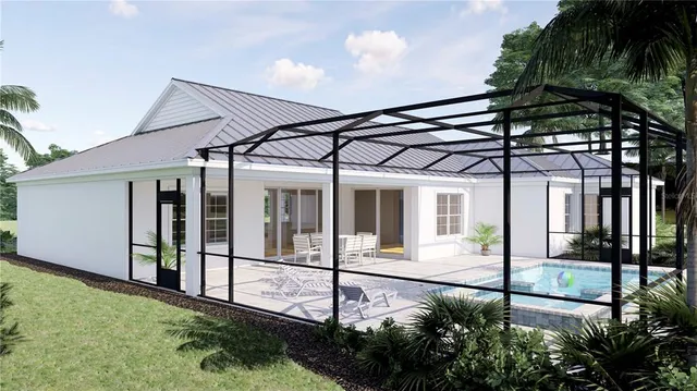 a view of a house with backyard and garden