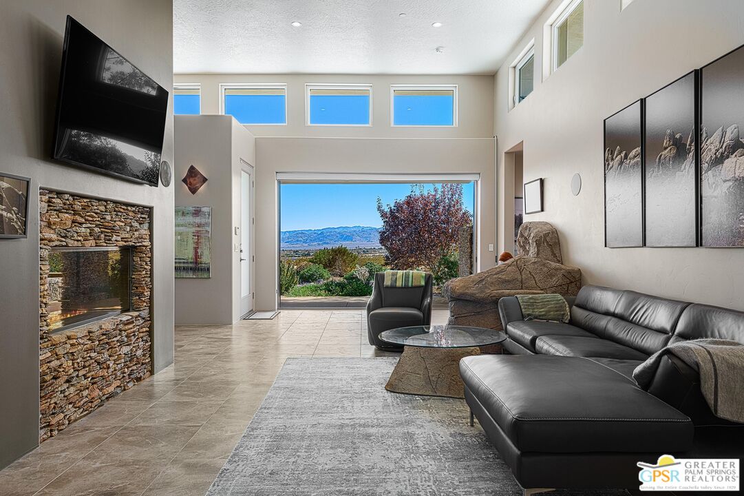 4974 Avenida Del Sol Joshua Tree, CA 92252 - Photo 12 of 36 a living room with furniture and a flat screen tv