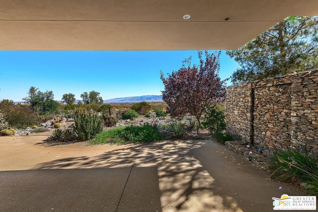 4974 Avenida Del Sol Joshua Tree, CA 92252 - Photo 13 of 36 a view of a road with a yard