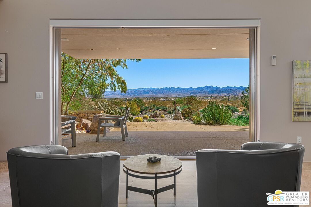 4974 Avenida Del Sol Joshua Tree, CA 92252 - Photo 15 of 36 a view of a living room and a window
