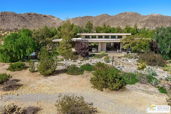 an aerial view of a house with a garden