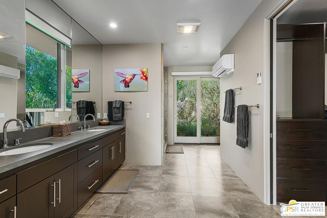 4974 Avenida Del Sol Joshua Tree, CA 92252 - Photo 25 of 36 a kitchen with stainless steel appliances granite countertop a refrigerator and a sink