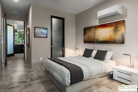 a bathroom with a double vanity sink toilet and shower