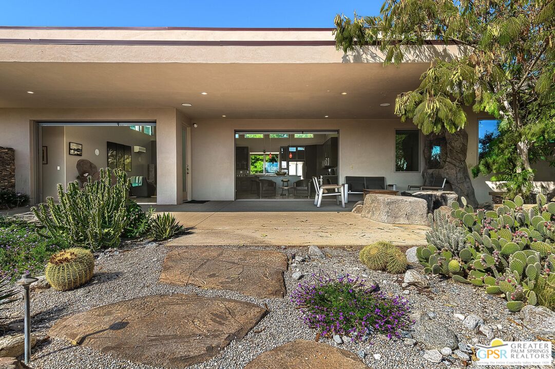 4974 Avenida Del Sol Joshua Tree, CA 92252 - Photo 7 of 36 a view of living room filled with furniture and flowers