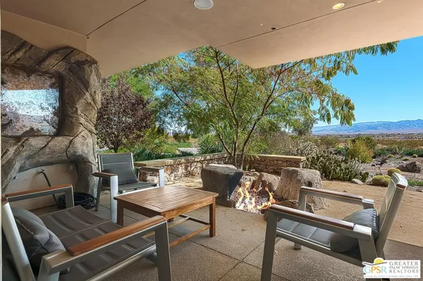 a view of a patio with swimming pool