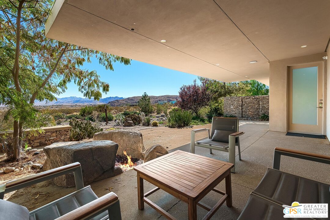 4974 Avenida Del Sol Joshua Tree, CA 92252 - Photo 9 of 36 a view of a patio with swimming pool
