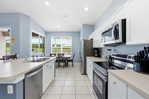 a dining room with furniture window and outside view