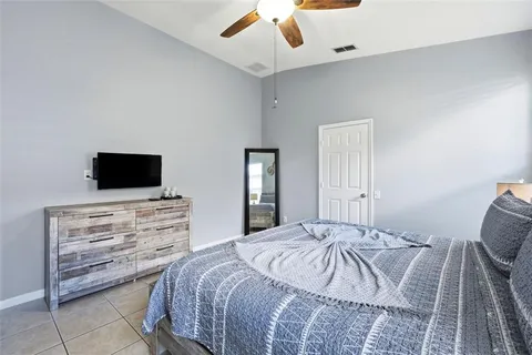 a spacious bathroom with a granite countertop sink and a mirror