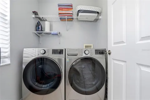 a room with furniture a air conditioner and a rug