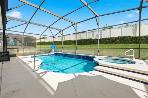 a view of a swimming pool with a patio
