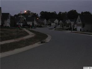 3092 Clover Road Northwest, Unit 113 Concord, NC 28027 - Photo 4 of 4 a view of street with view of residential house and outdoor space