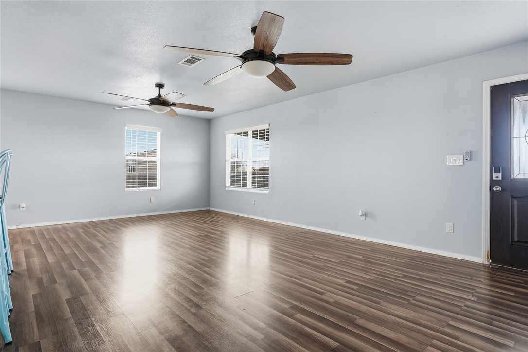 131 Janecek Road Rockport, TX 78382 - Photo 11 of 38 a view of empty room with wooden floor and fan