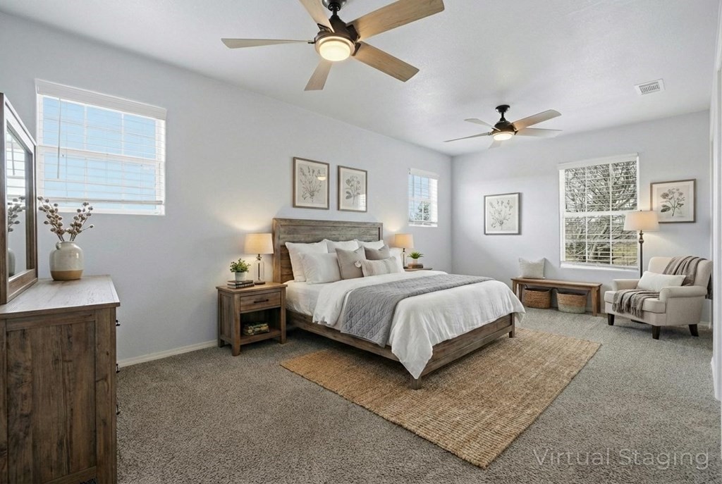 131 Janecek Road Rockport, TX 78382 - Photo 18 of 38 a spacious bedroom with a bed couch and a window