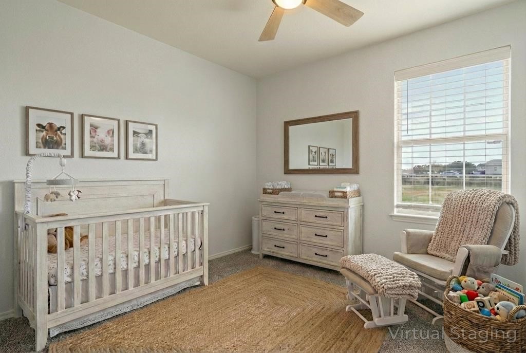 131 Janecek Road Rockport, TX 78382 - Photo 23 of 38 a bedroom with furniture and a window