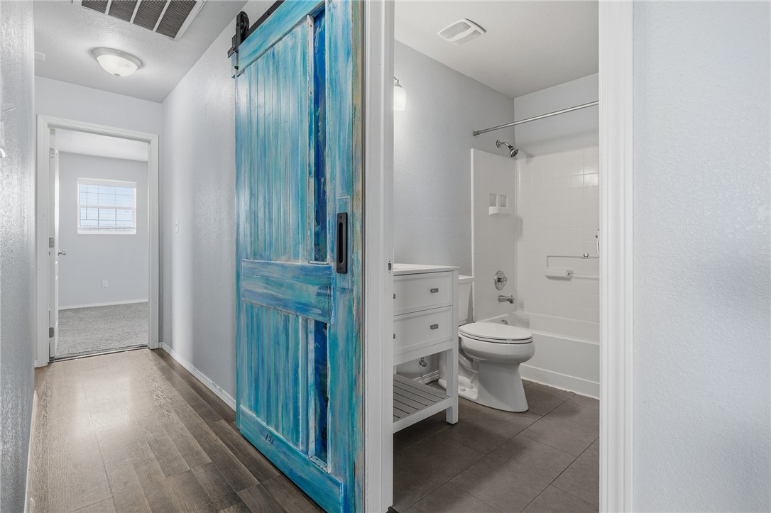 131 Janecek Road Rockport, TX 78382 - Photo 26 of 38 a bathroom with a toilet a sink and shower