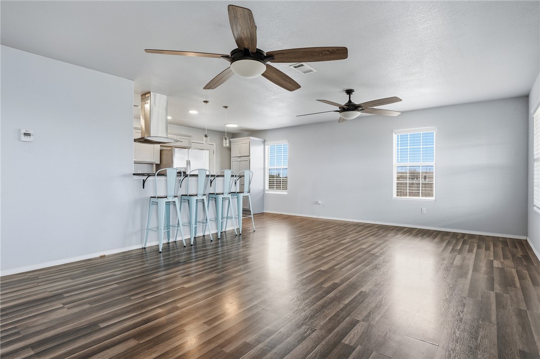 131 Janecek Road Rockport, TX 78382 - Photo 10 of 38 a view of empty room with wooden floor and fan