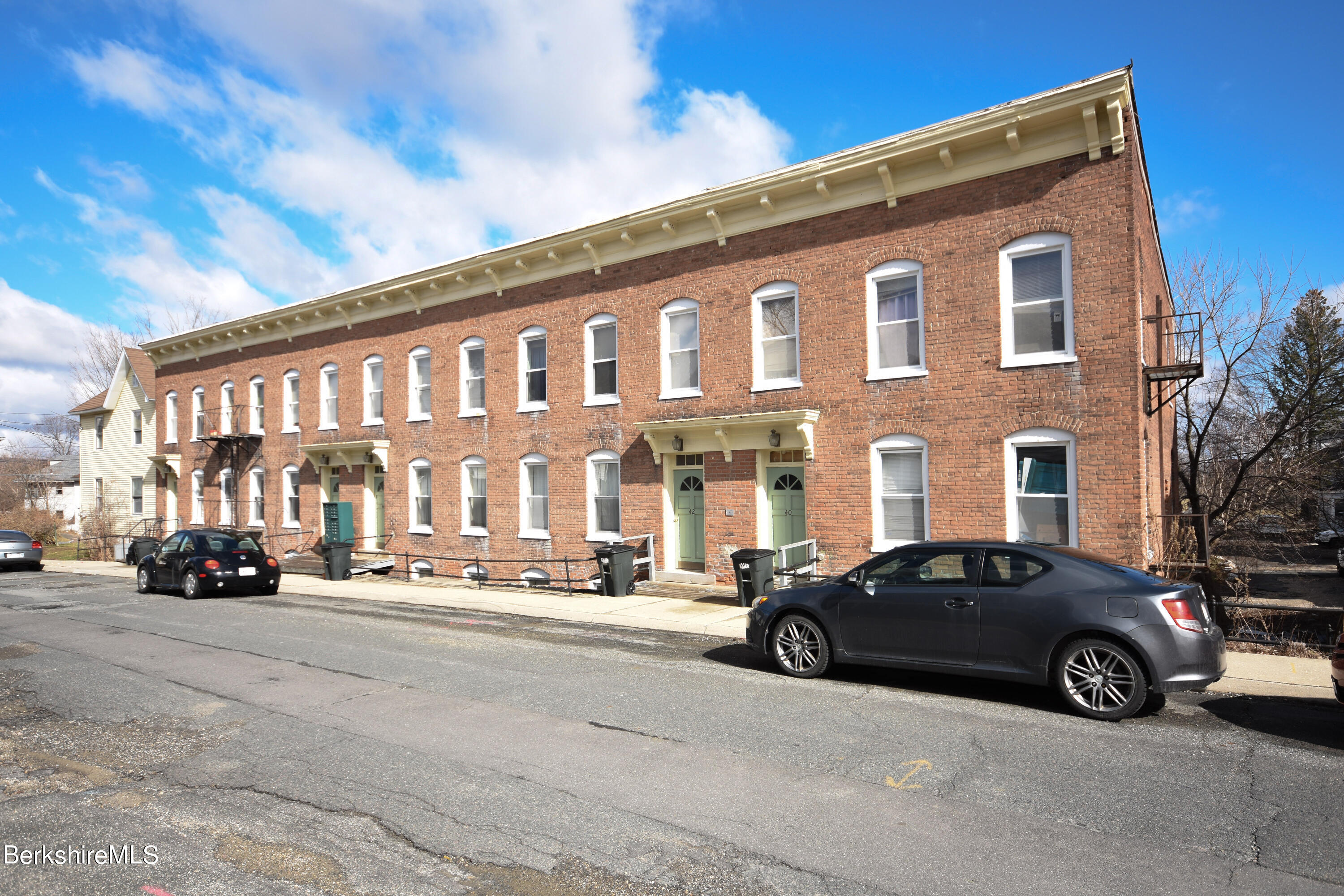 40-48 Reed Street Pittsfield, MA 01201 - Photo 1 of 35 a car parked in front of a white house