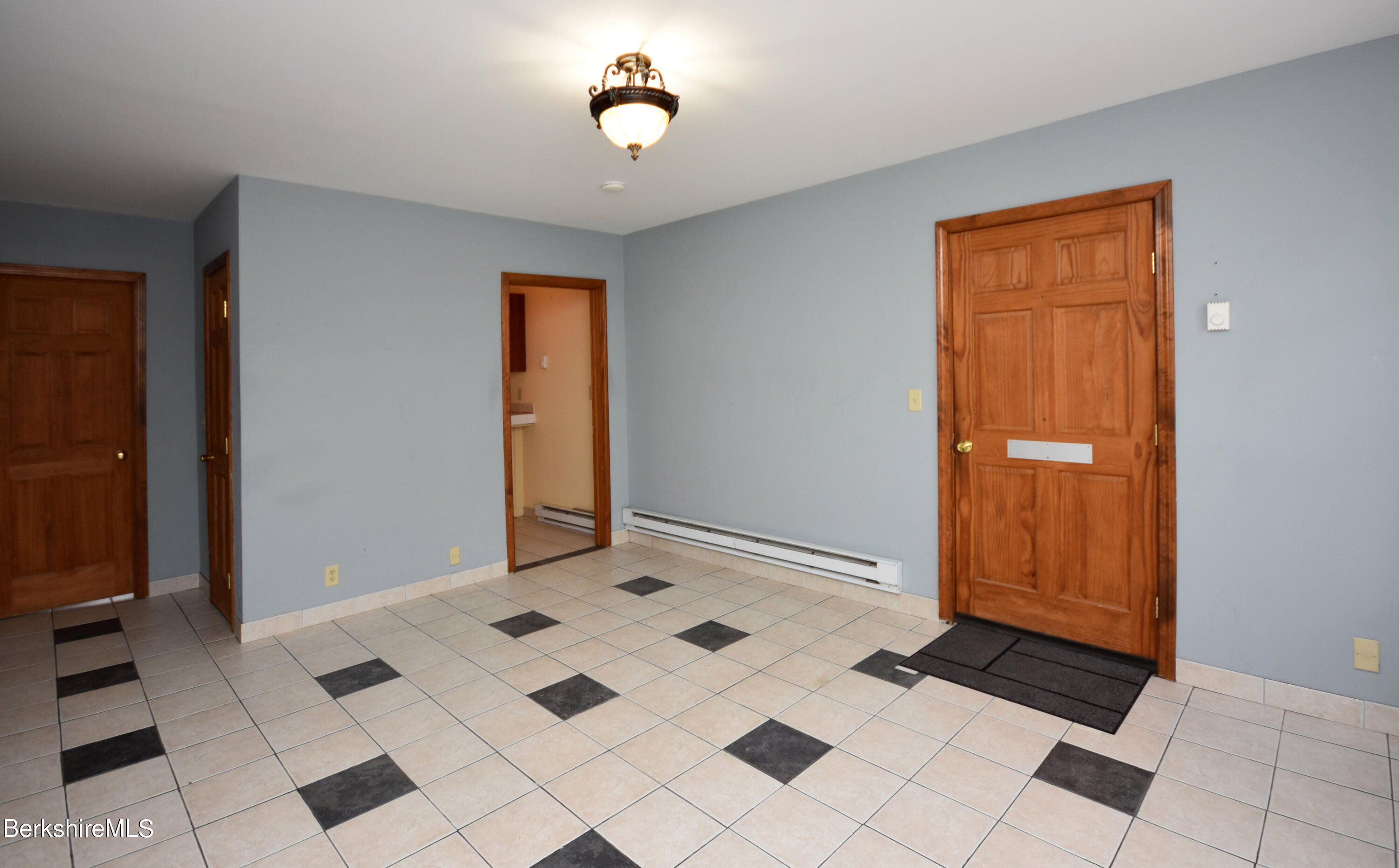40-48 Reed Street Pittsfield, MA 01201 - Photo 17 of 35 a view of an entryway with a chandelier