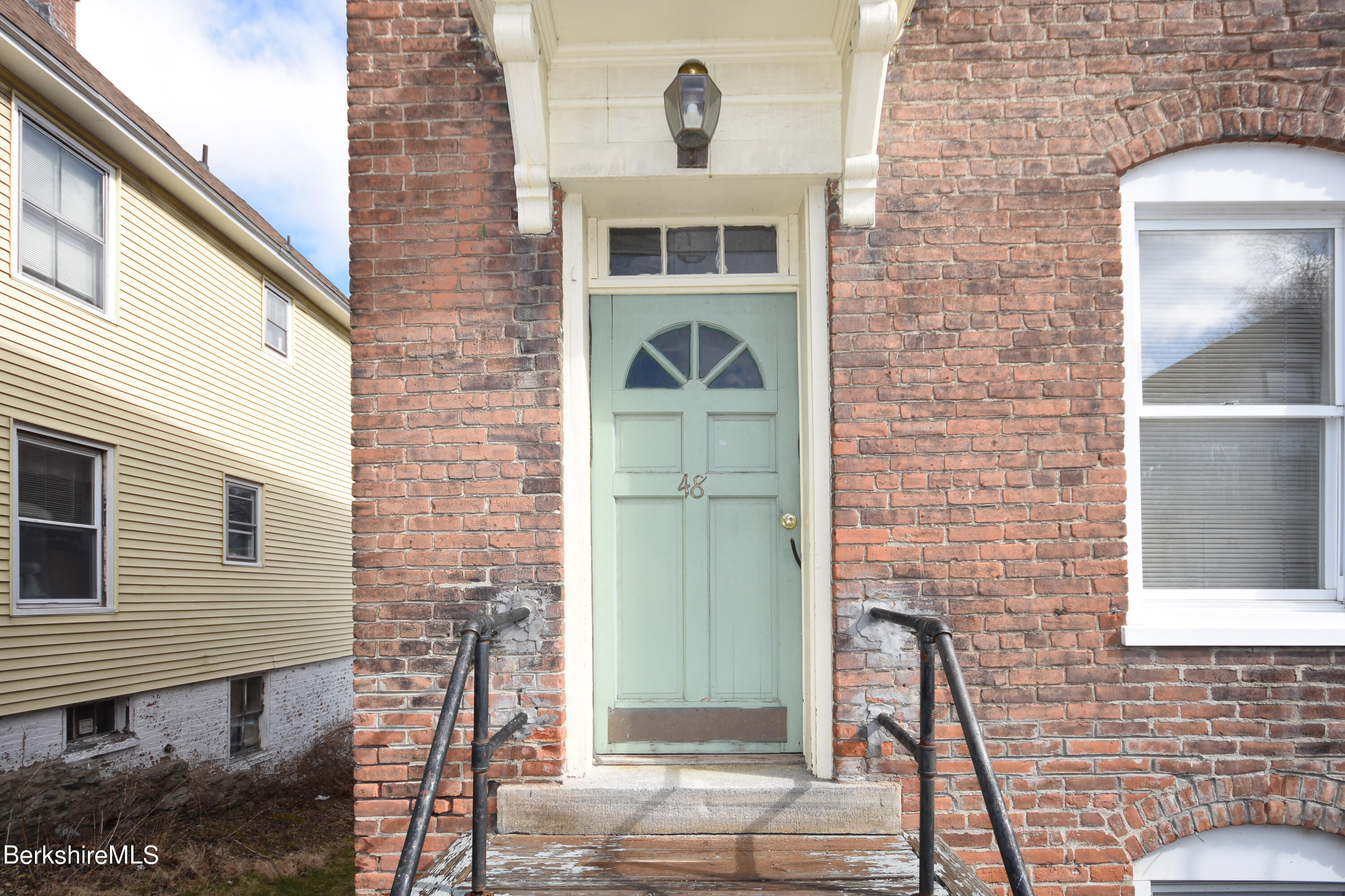 40-48 Reed Street Pittsfield, MA 01201 - Photo 4 of 35 a front view of a house with a yard
