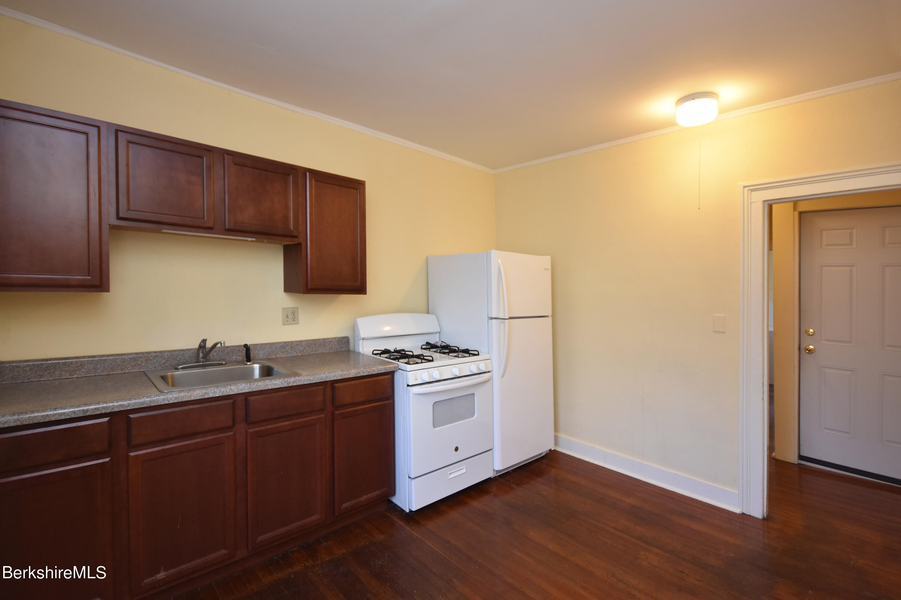 40-48 Reed Street Pittsfield, MA 01201 - Photo 9 of 35 a kitchen with a sink cabinets and wooden floor