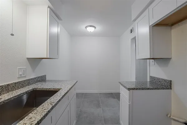 a bathroom with a sink toilet and vanity