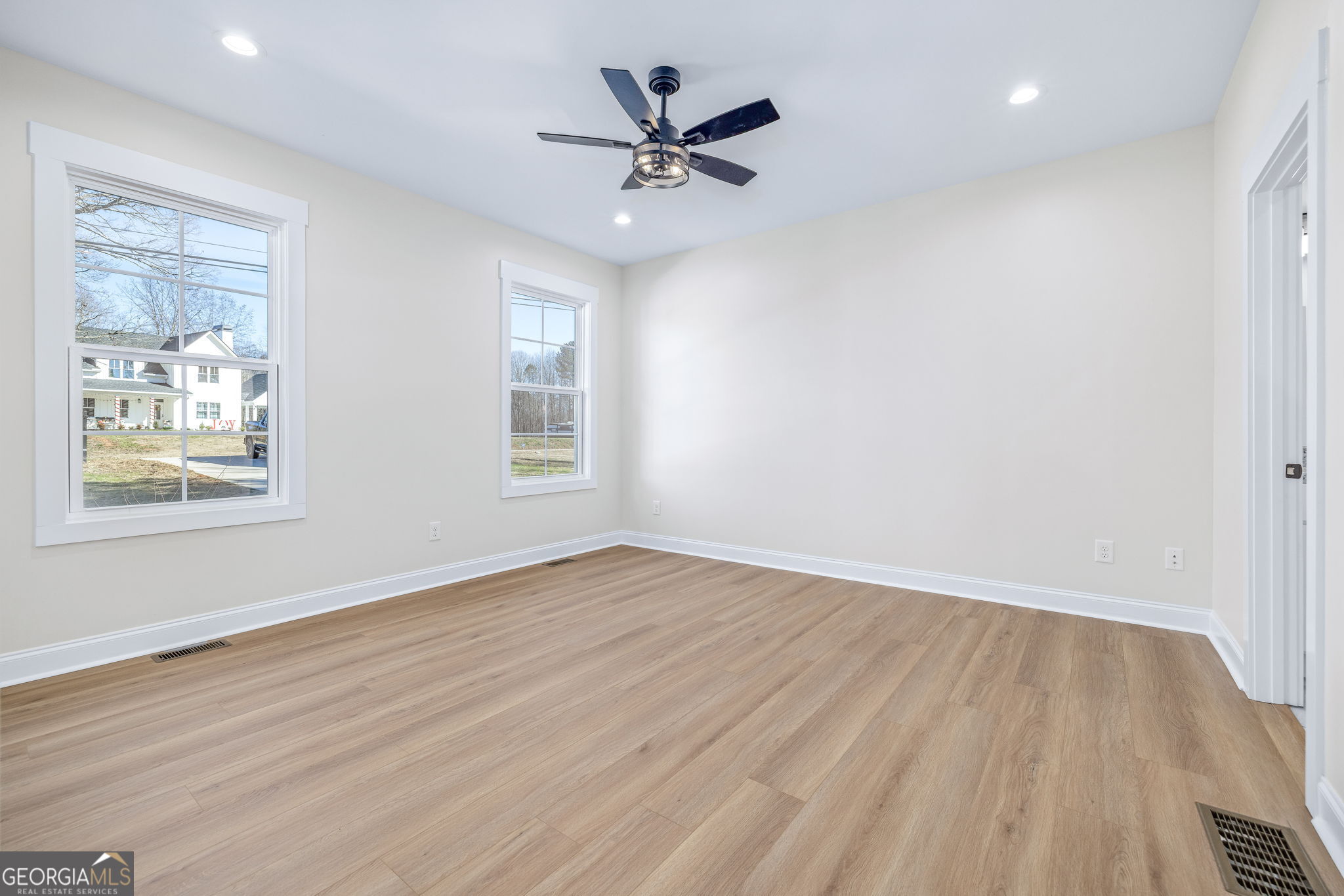 178 Hazel Creek Road Mount Airy, GA 30563 - Photo 12 of 34 wooden floor in an empty room with a window