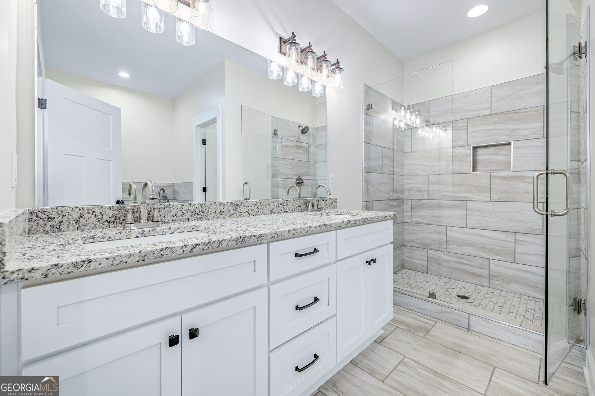 178 Hazel Creek Road Mount Airy, GA 30563 - Photo 14 of 34 a bathroom with a granite countertop double vanity sink mirror and shower