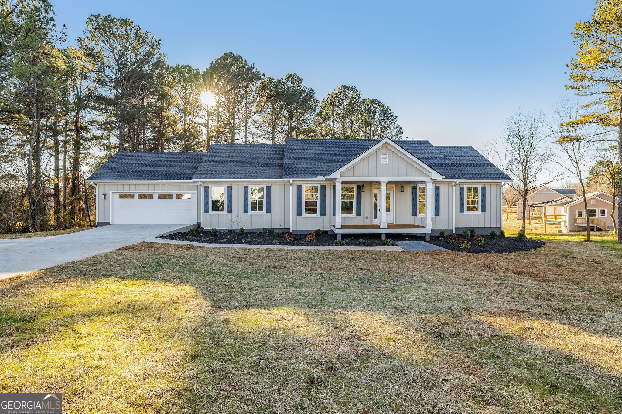 178 Hazel Creek Road Mount Airy, GA 30563 - Photo 2 of 34 a front view of a house with a garden