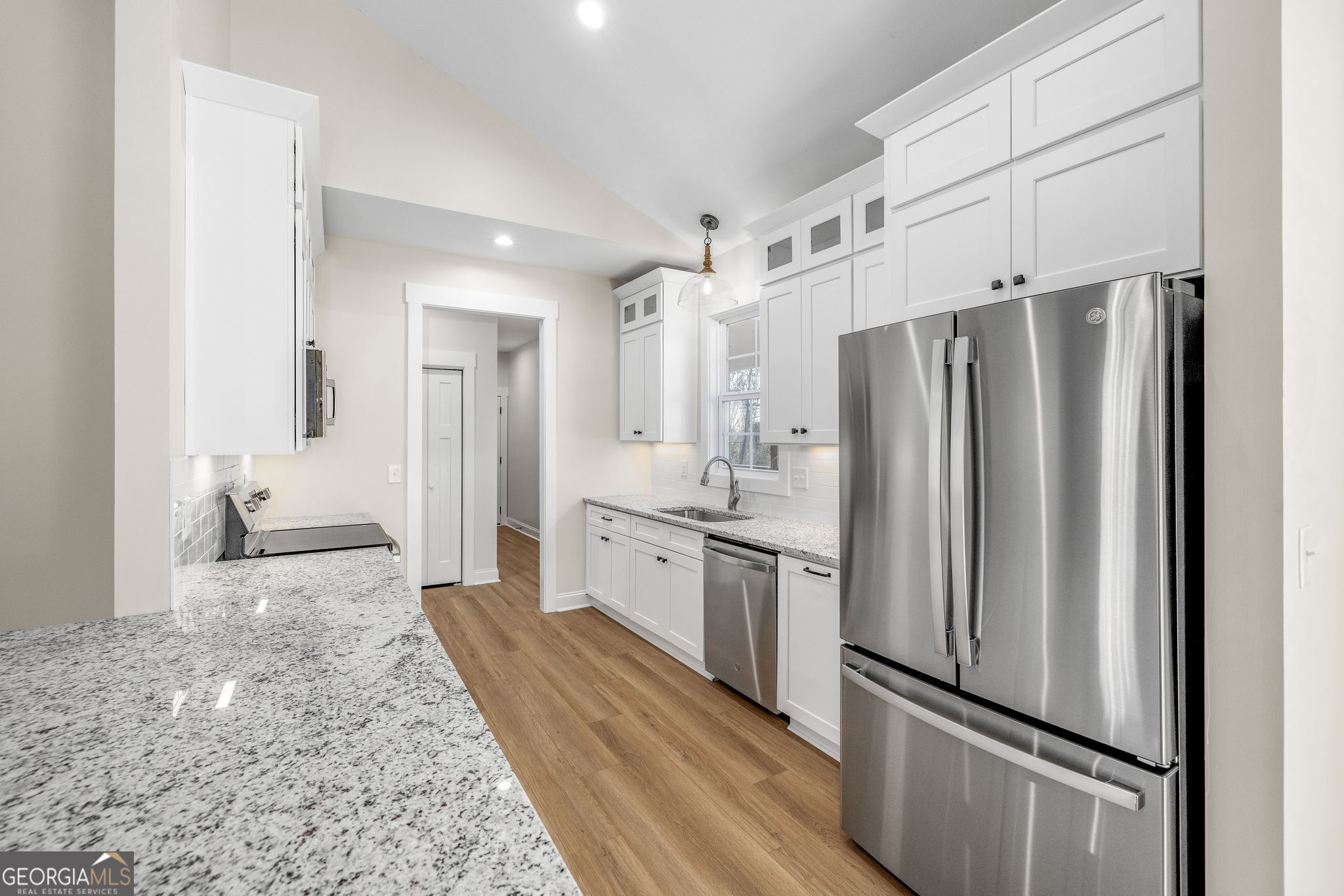 178 Hazel Creek Road Mount Airy, GA 30563 - Photo 3 of 34 a kitchen with stainless steel appliances a refrigerator sink and cabinets