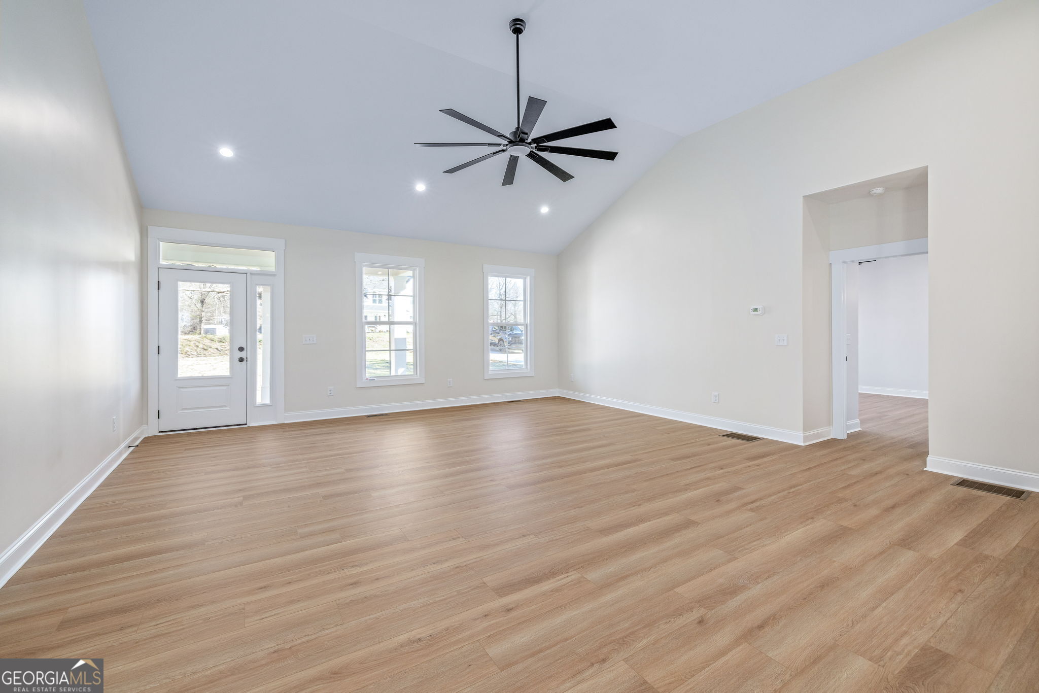 178 Hazel Creek Road Mount Airy, GA 30563 - Photo 9 of 34 a view of an empty room with window and wooden floor