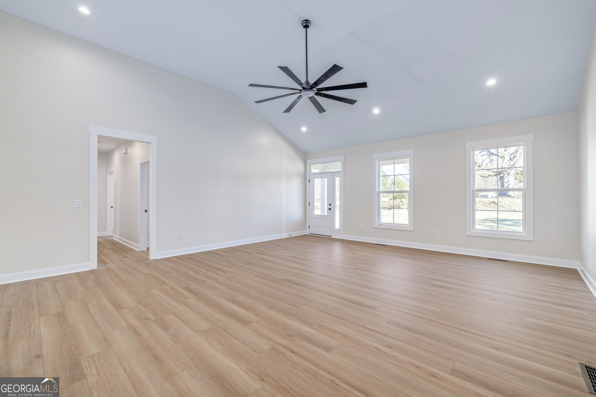 178 Hazel Creek Road Mount Airy, GA 30563 - Photo 10 of 34 a view of an empty room with window and wooden floor