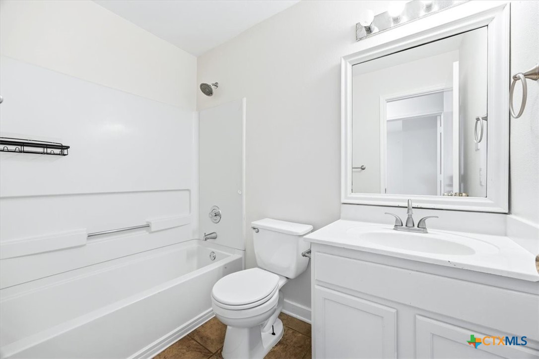 2030 Castleberry Ridge New Braunfels, TX 78130 - Photo 22 of 43 a bathroom with a sink a toilet and shower