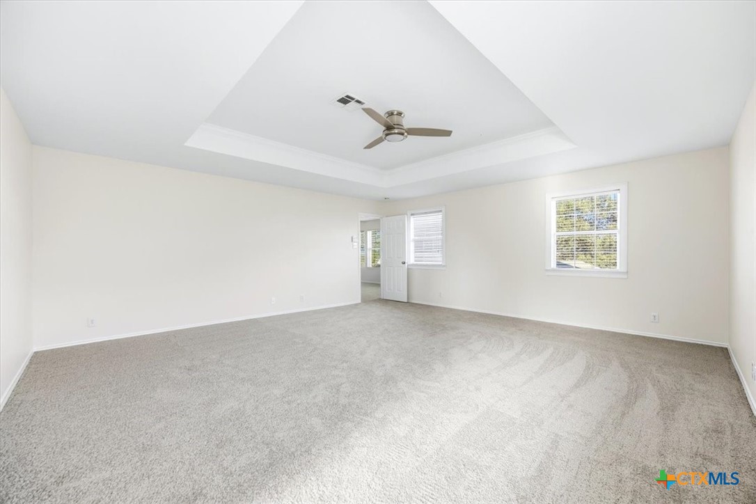 2030 Castleberry Ridge New Braunfels, TX 78130 - Photo 27 of 43 an empty room with windows and ceiling fan