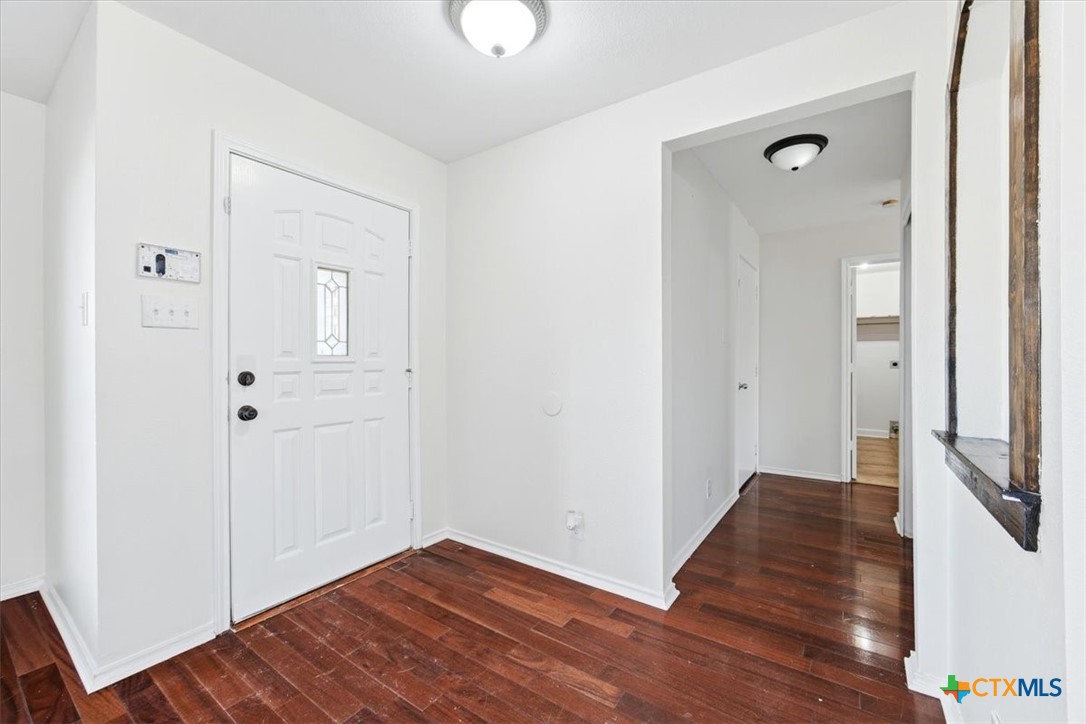 2030 Castleberry Ridge New Braunfels, TX 78130 - Photo 8 of 43 a view of a hallway with wooden floor