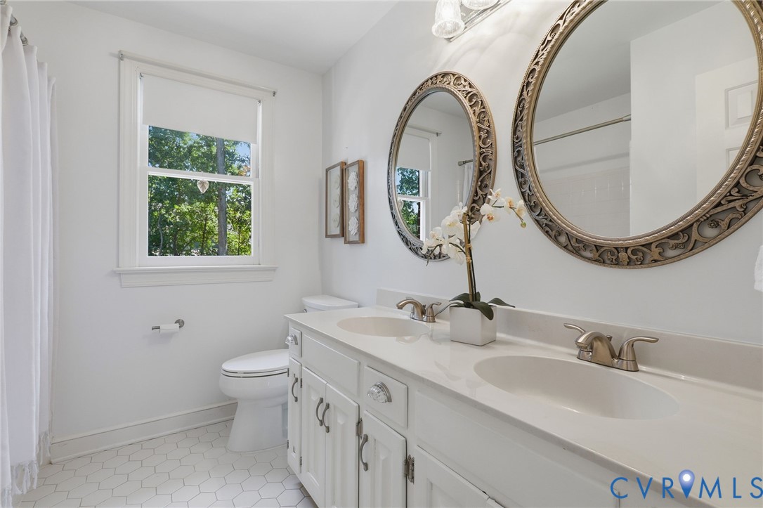 2311 Castle Hill Road Midlothian, VA 23113 - Photo 32 of 39 Dual vanity with white cabinetry and integrated si