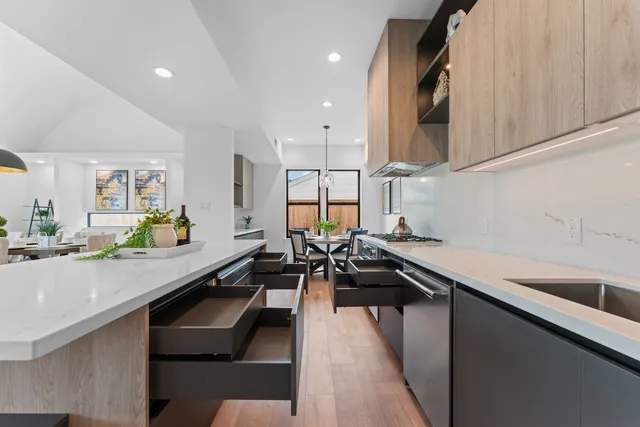 a kitchen with a sink appliances and cabinets