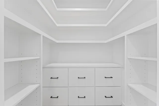 a view of an empty walk in closet