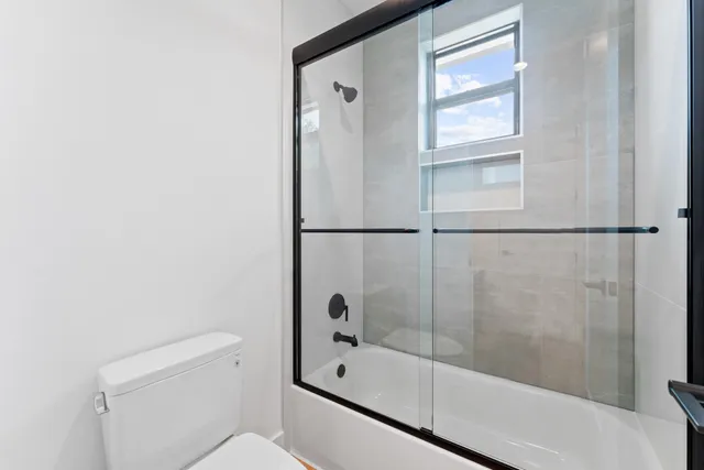 a bathroom with a bathtub and a shower
