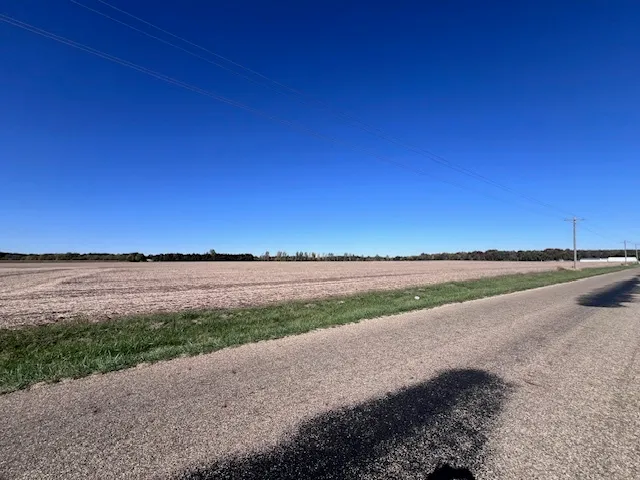 a view of a lake and yard