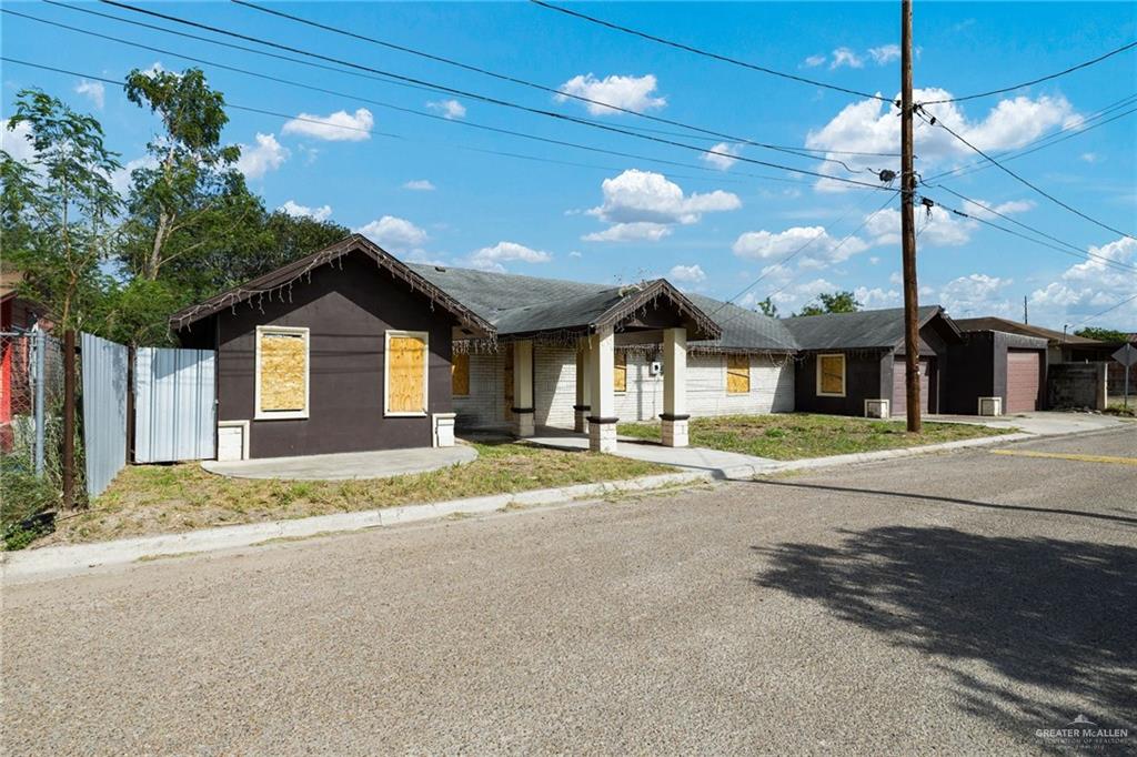 879 Austin Road Roma, TX 78584 - Photo 1 of 7 Single-story structure featuring a combination of dark and light exterior finishes
