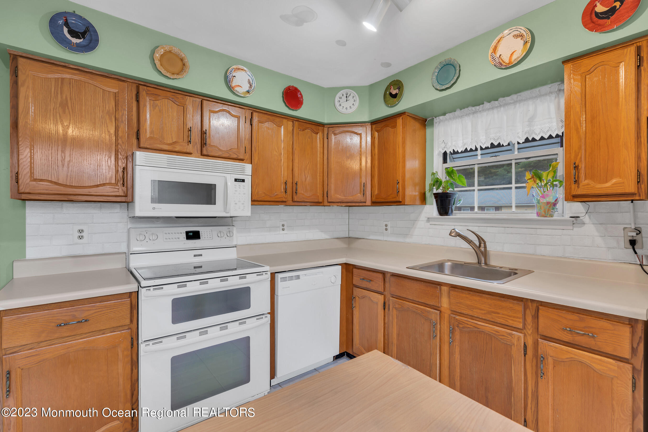 11 A Amherst Road Whiting, NJ 08759 - Photo 13 of 31 a kitchen with cabinets stainless steel appliances and a sink