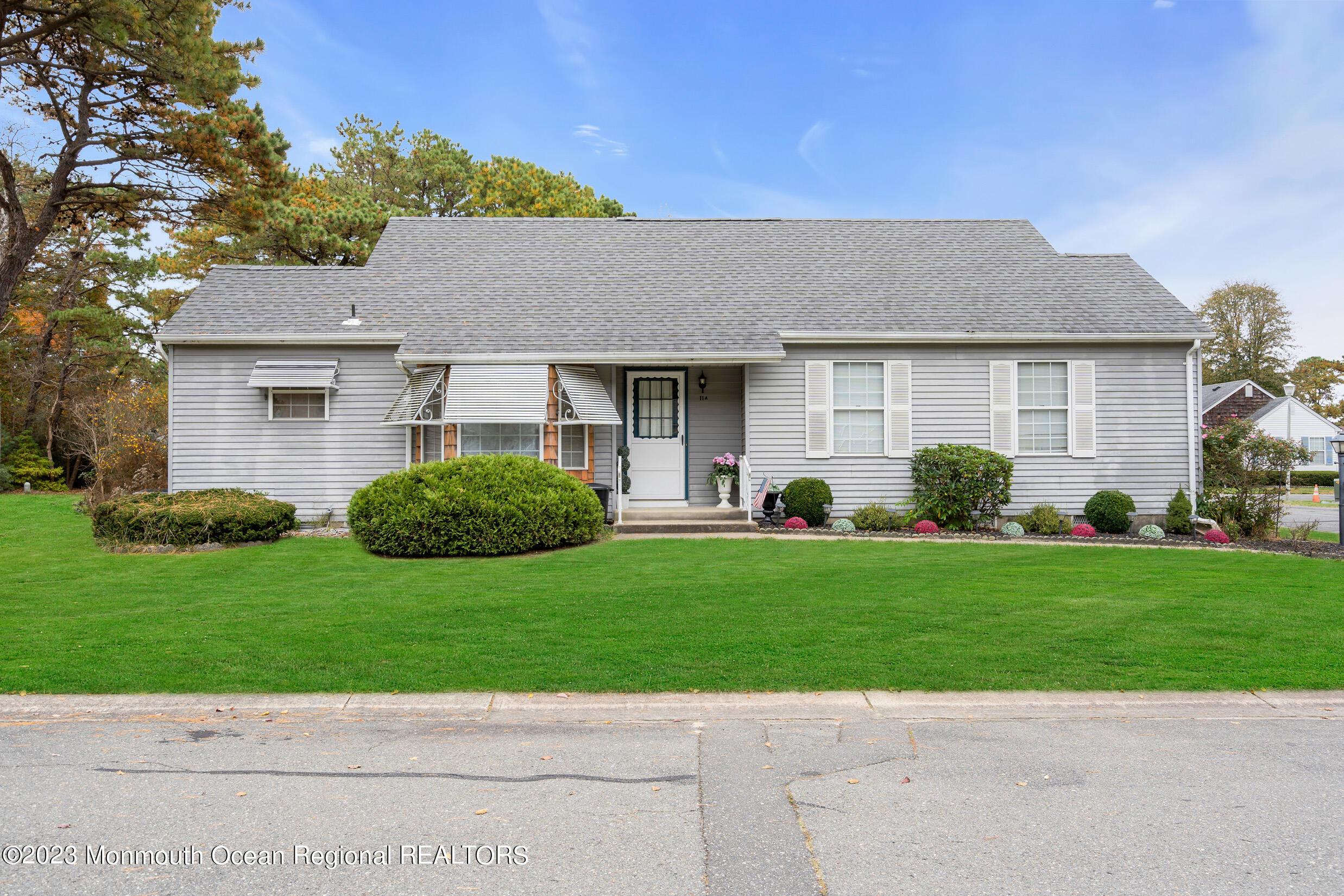 11 A Amherst Road Whiting, NJ 08759 - Photo 4 of 31 a view of a house with a yard and potted plants