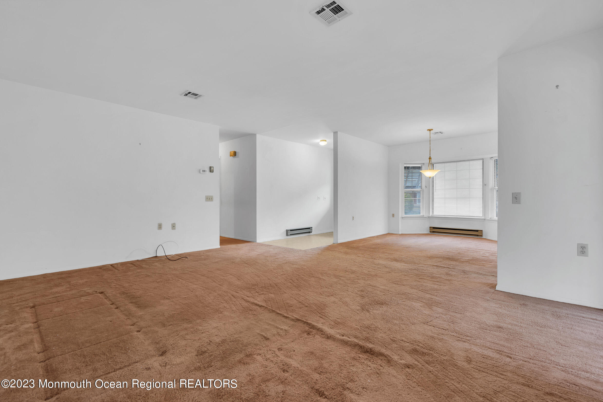 11 A Amherst Road Whiting, NJ 08759 - Photo 7 of 31 a view of an empty room with a kitchen
