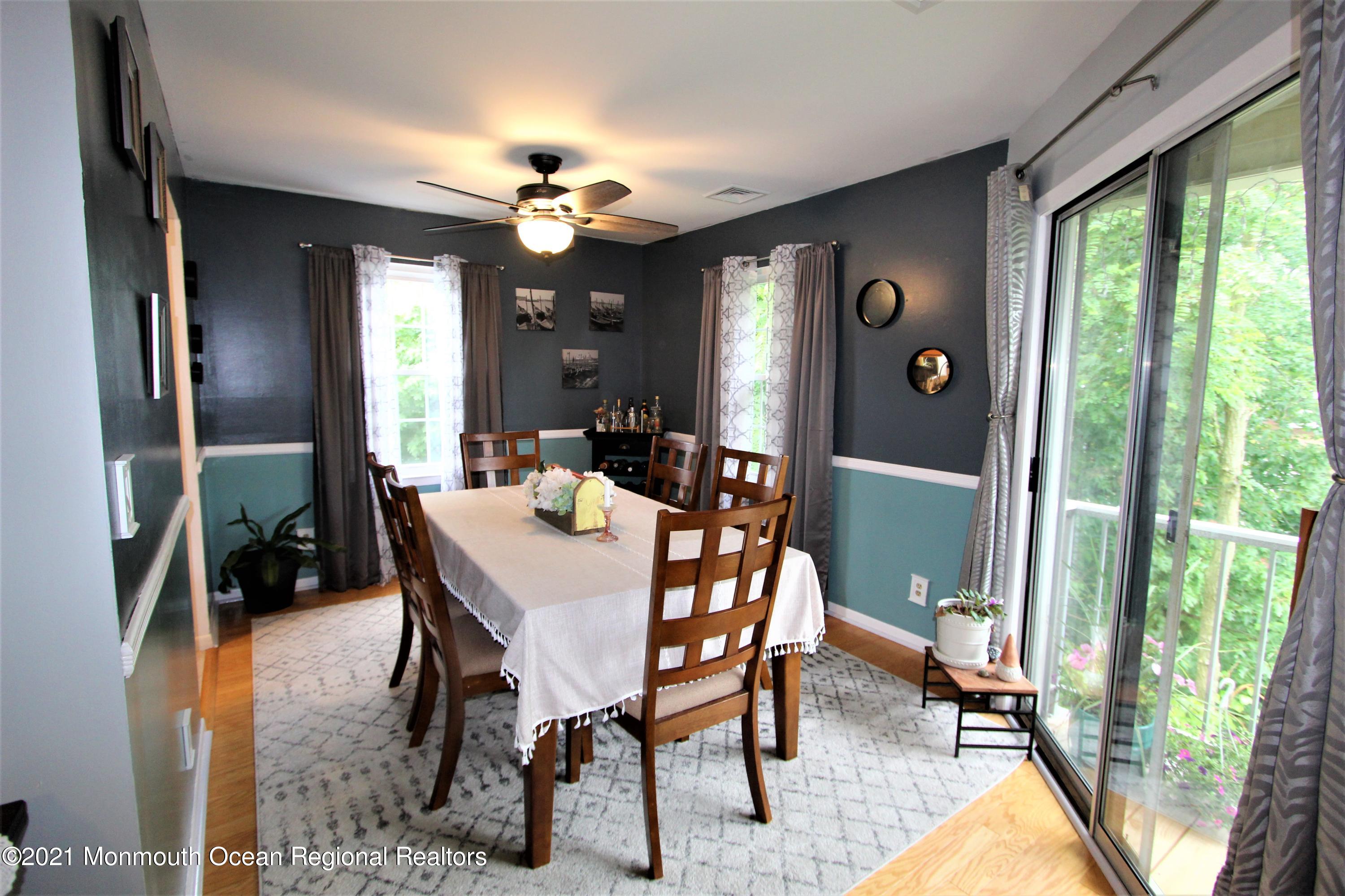 231 Atlantic Street, Unit 48 Keyport, NJ 07735 - Photo 12 of 32 a view of a dining room with furniture window and outside view